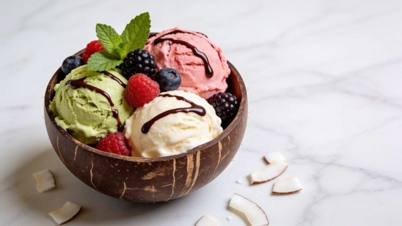 Coconut bowl with scoops of ice cream and fresh berries